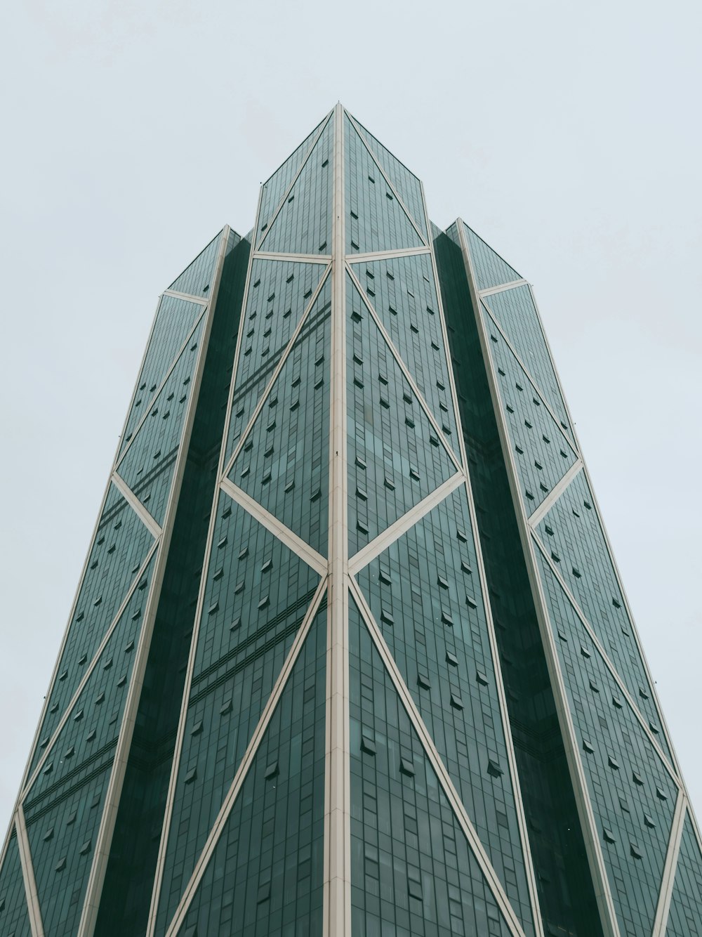 blue glass walled high rise building