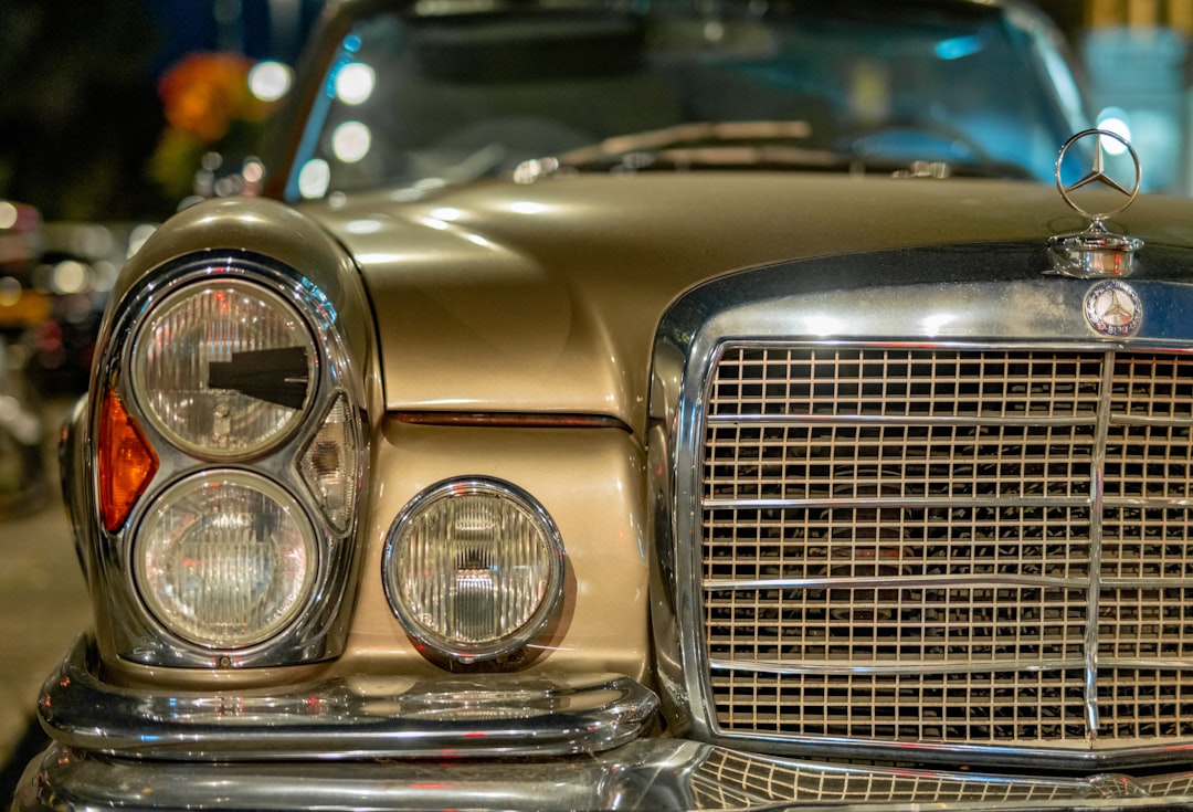 silver car with yellow and blue lights