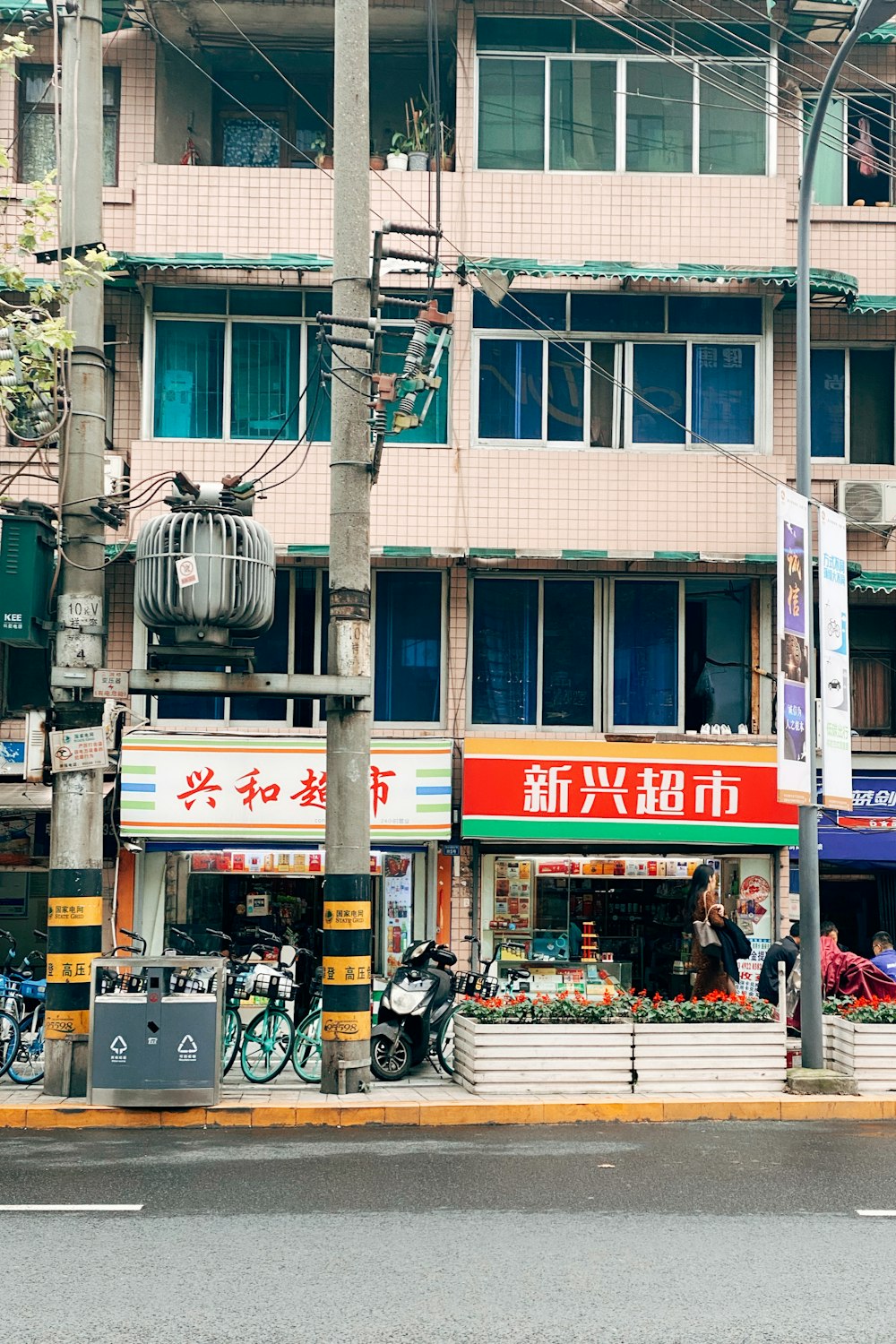 cars parked in front of brown concrete building during daytime