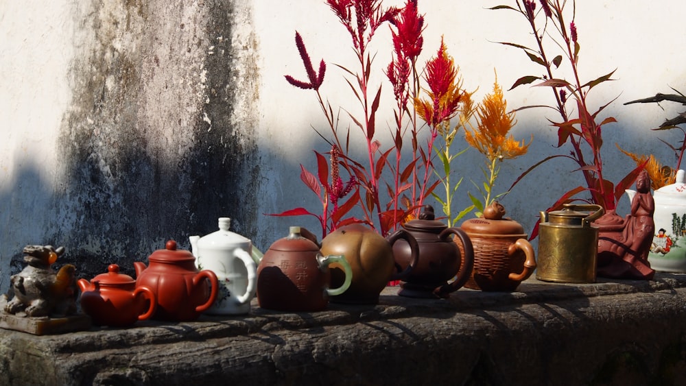 brown ceramic teapot on brown wooden table