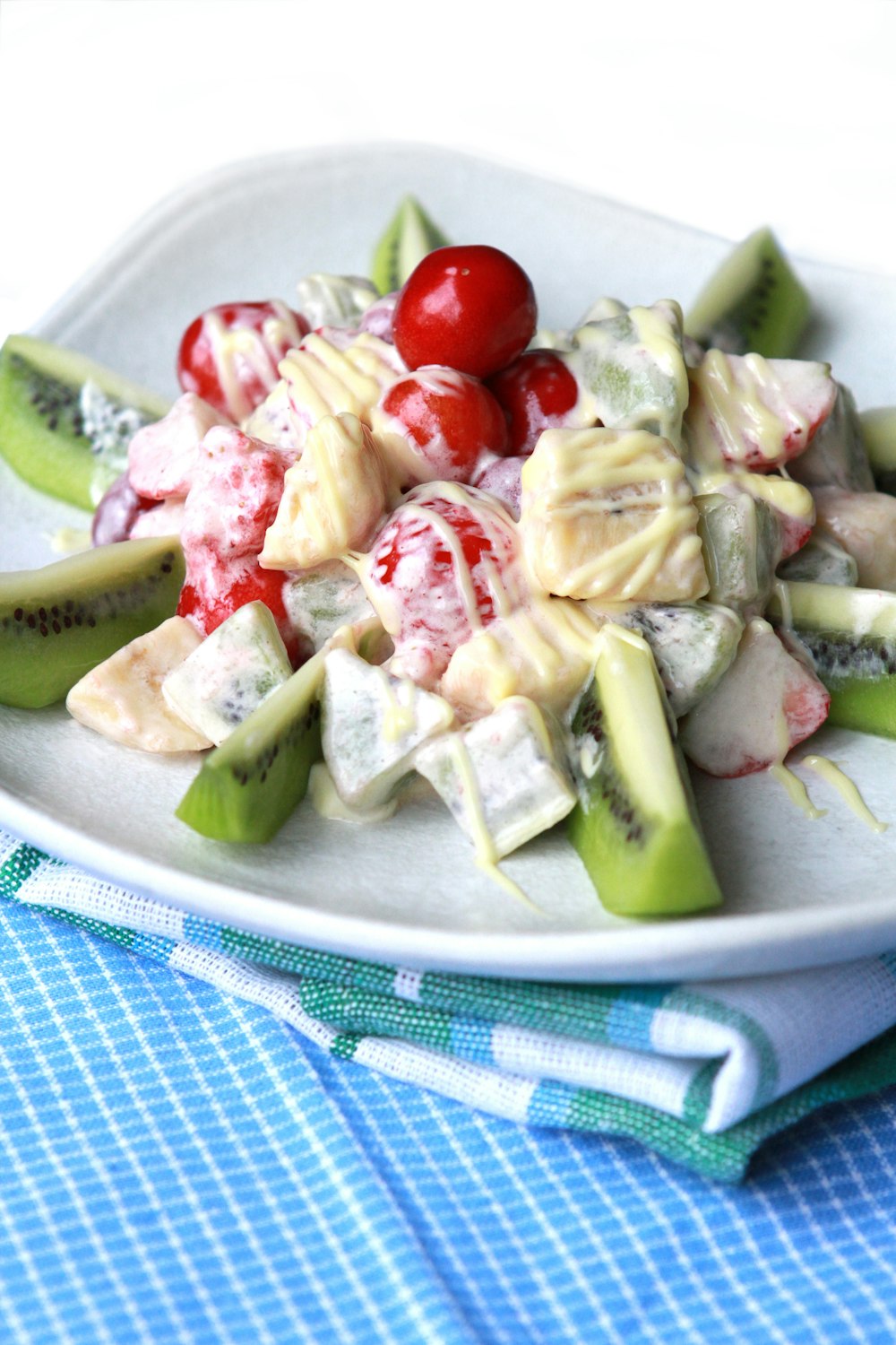 sliced fruits on white ceramic plate