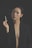 A woman with closed eyes holds a cigarette in one hand. She is wearing a black blazer with no shirt underneath. The background is dark, emphasizing her facial features and the minimal light reflecting off her skin.