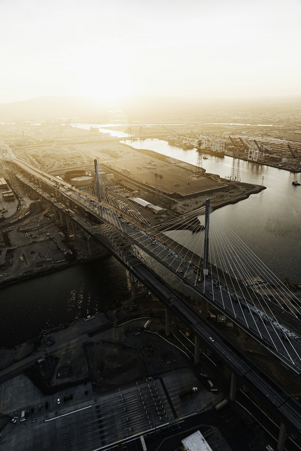 brown bridge over body of water during daytime