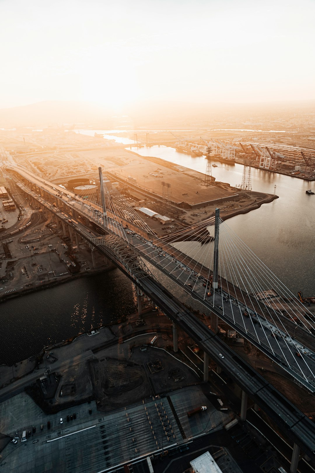 brown bridge over body of water during daytime