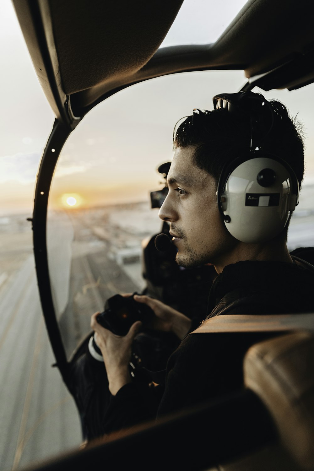 man in black jacket wearing black headphones