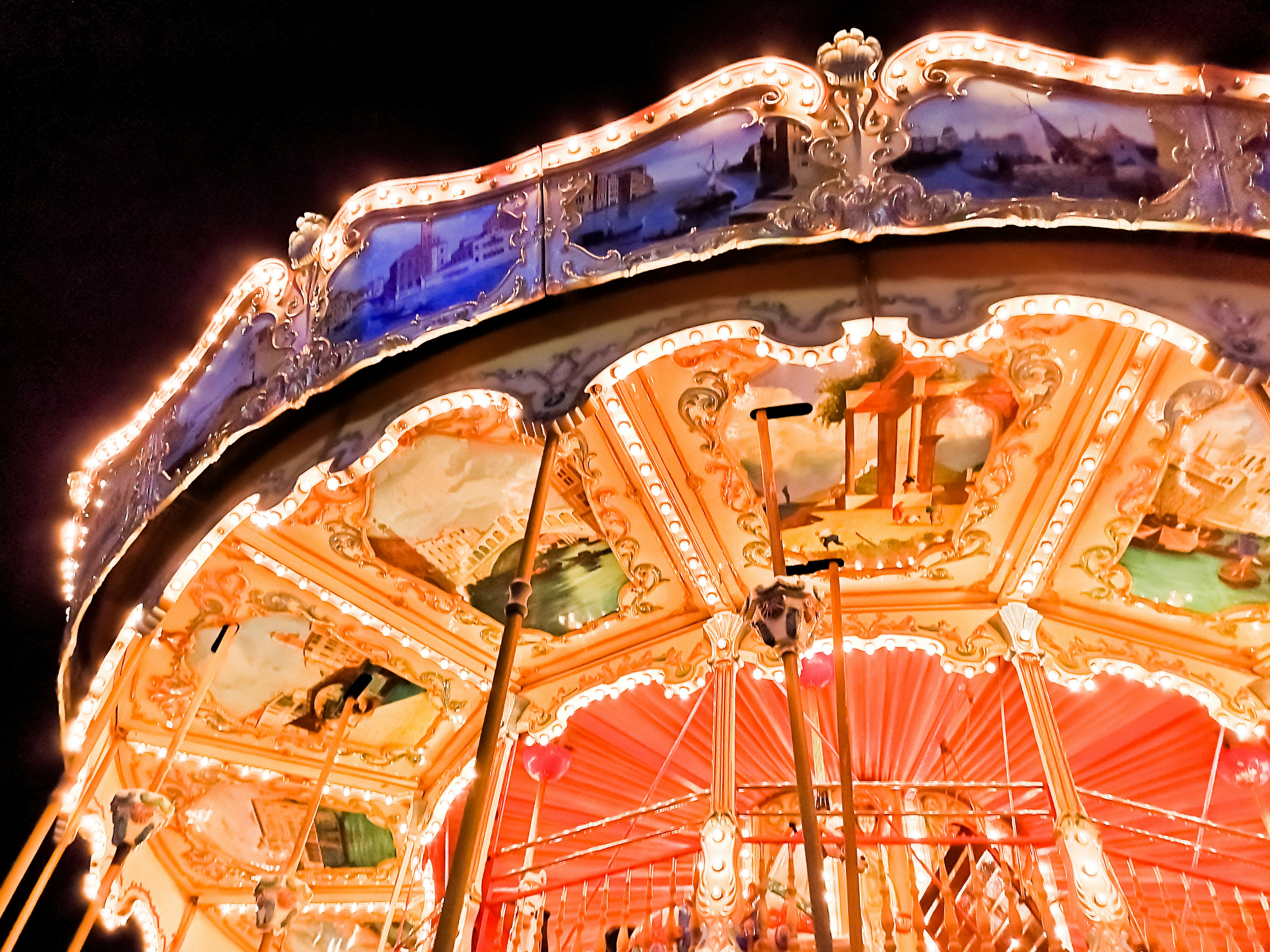 people riding on a carousel during night time