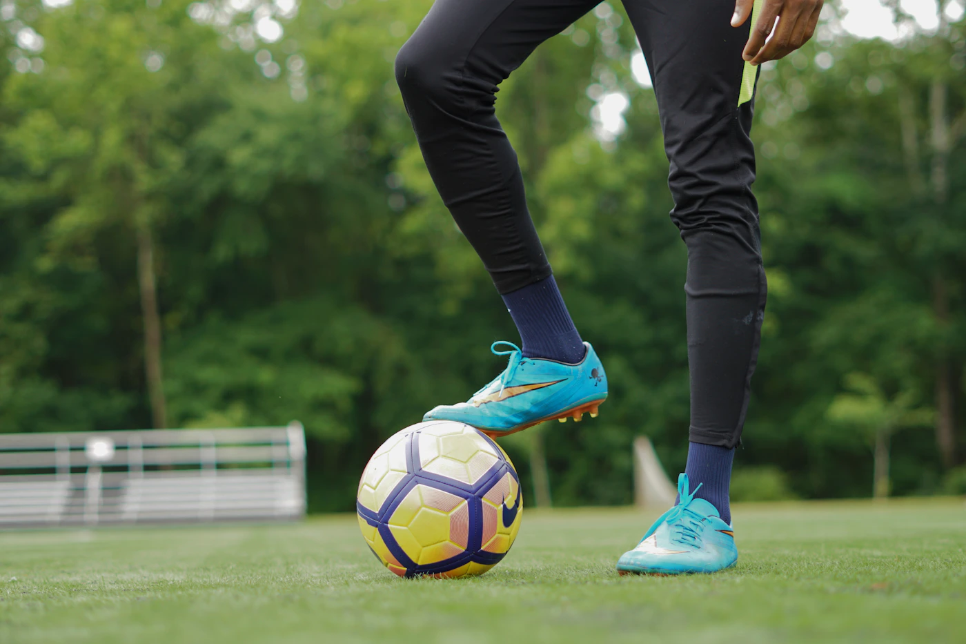 Young football players training outdoors