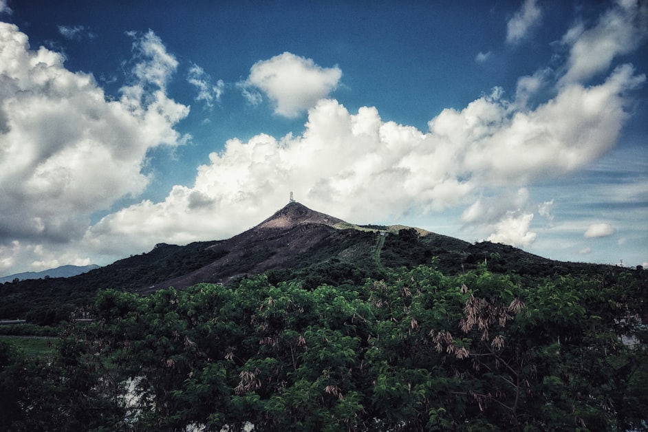 Green hills and mountains along the Hong Kong border with blue sky