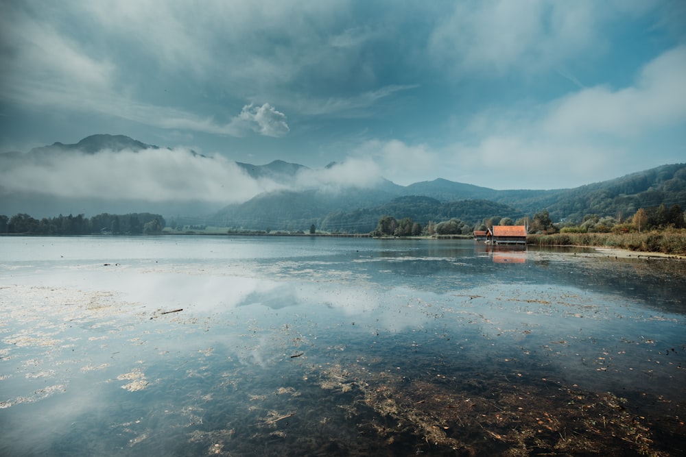 body of water under cloudy sky during daytime