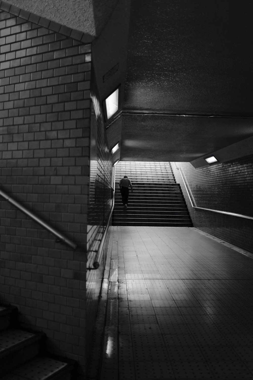 grayscale photo of a hallway