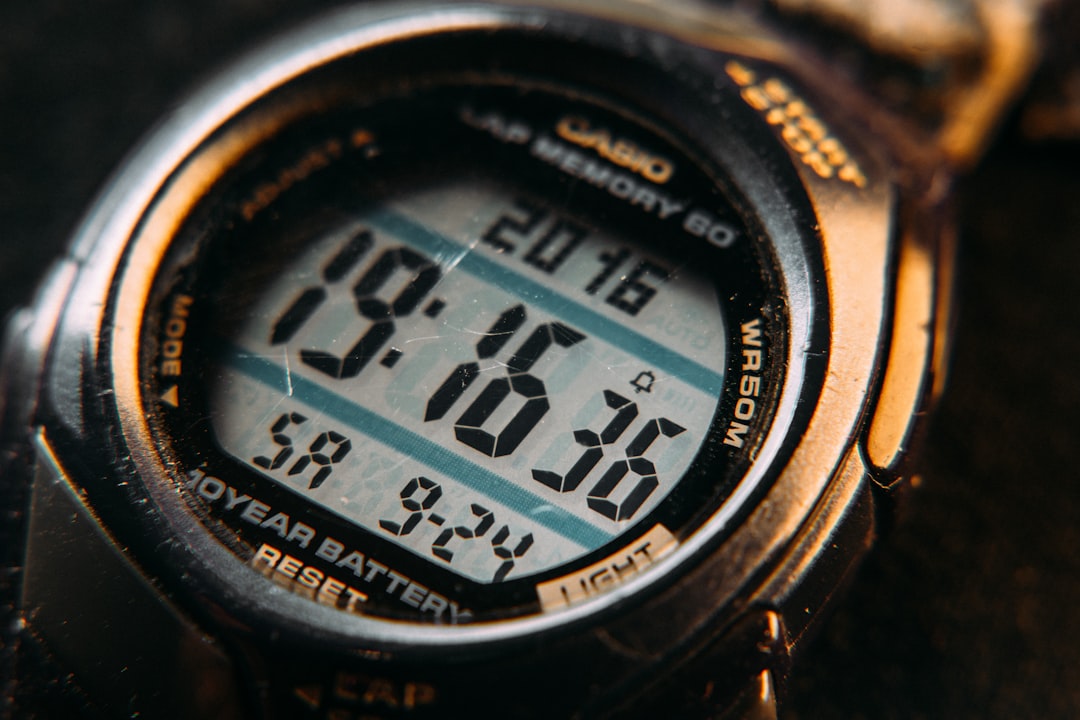 black and gray digital watch at 10 00