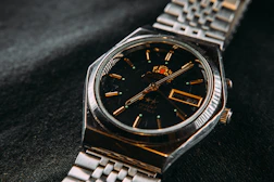 silver and gold analog watch