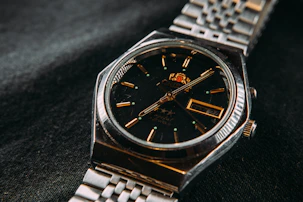 silver and gold analog watch