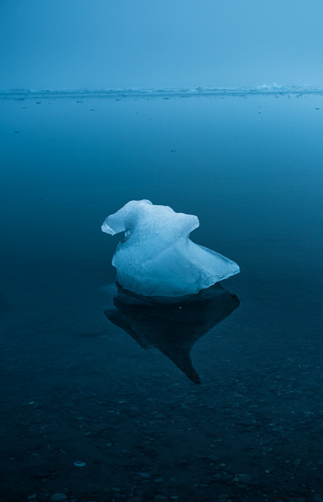 white ice on black sand