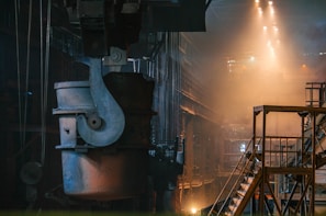 Wide shot of the etros production facility showcasing heavy machinery and metal structures.