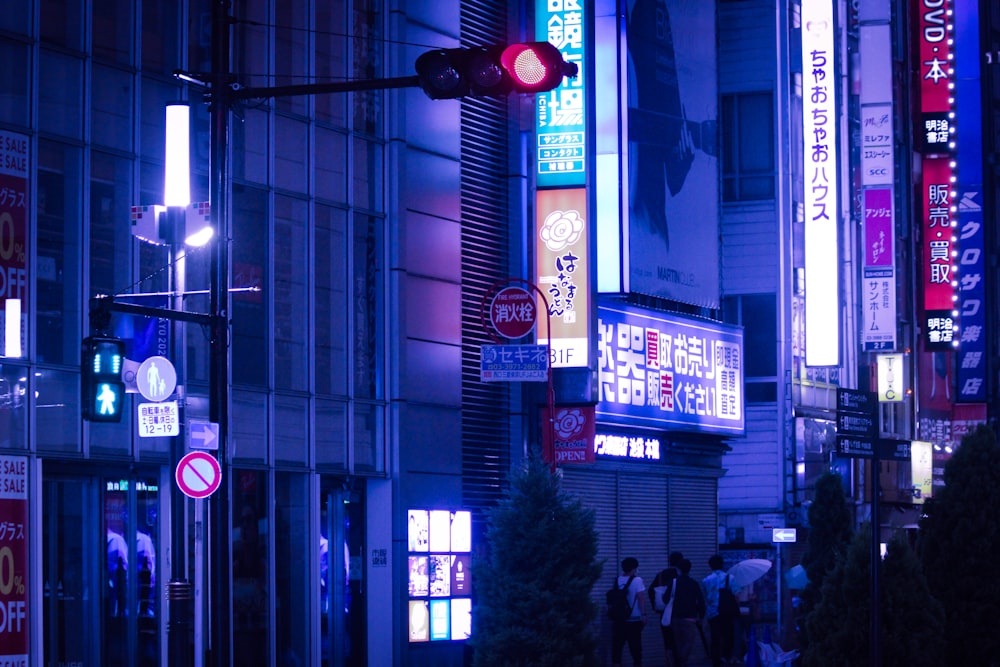 people walking on street during nighttime