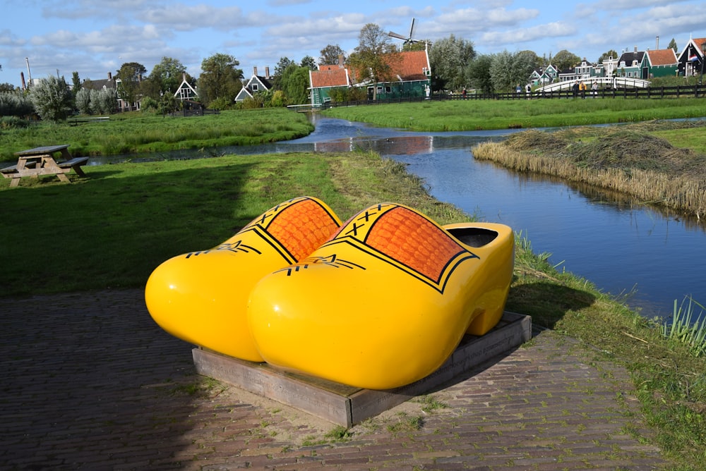 yellow and red rain boots on water