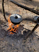 Close-up of a traditional cooking pot over an open fire