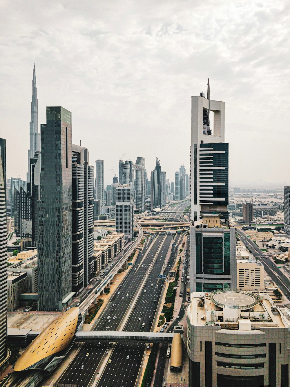 high rise buildings under white sky during daytime