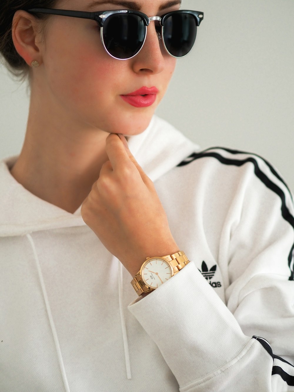 boy in white long sleeve shirt wearing black sunglasses