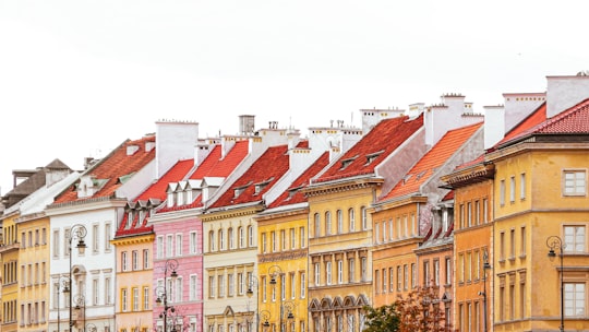 yellow and red concrete building in Warsaw Old Town Poland