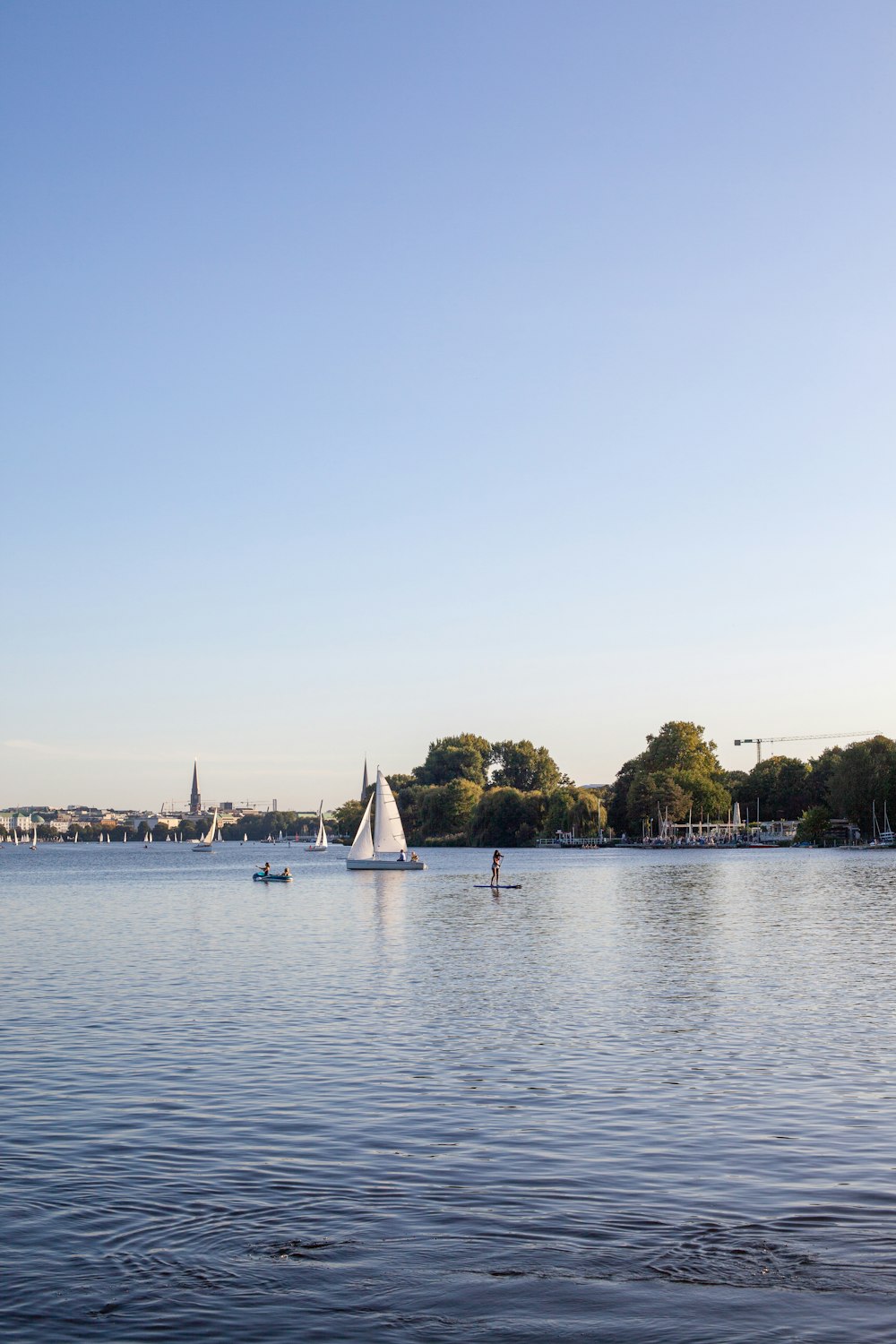 white sail boat on sea during daytime