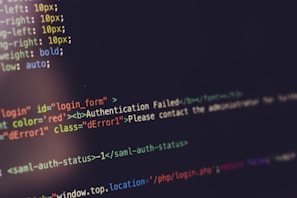 Lines of HTML and CSS code are displayed on a computer screen. The code features various elements and styles, including an authentication error message highlighted in red, indicating a failed login attempt. The syntax is color-coded for better readability.