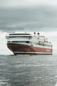 white and brown ship on sea during daytime