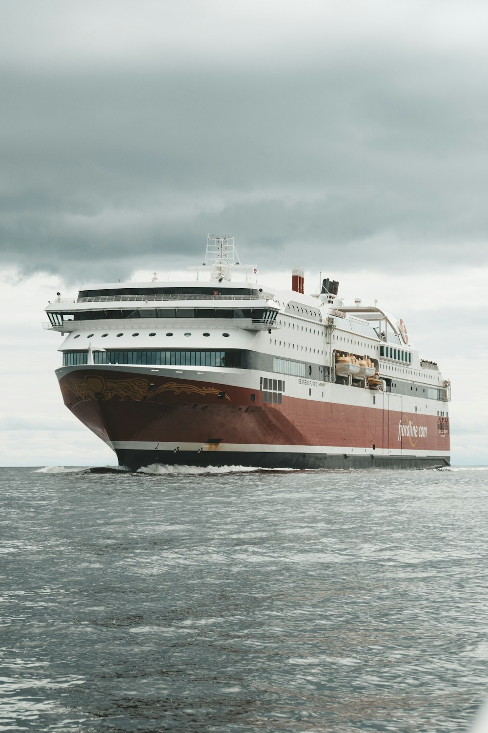 white and brown ship on sea during daytime