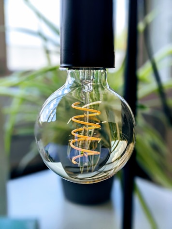 clear glass bottle with black lid