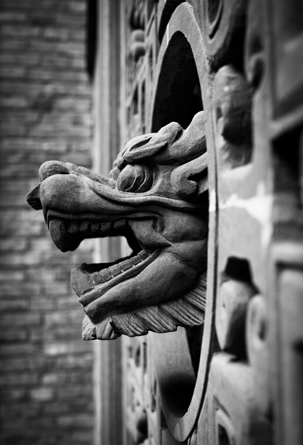 grayscale photo of human face statue