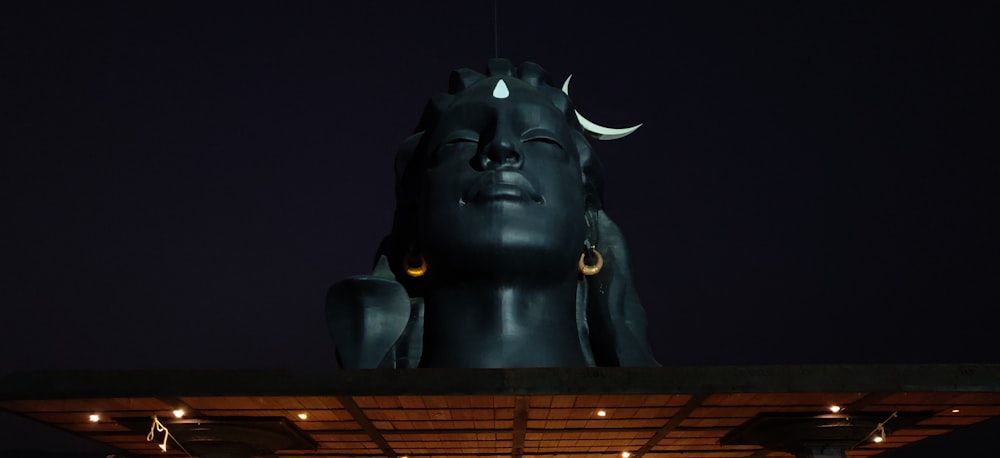 black horse head bust on brown wooden table