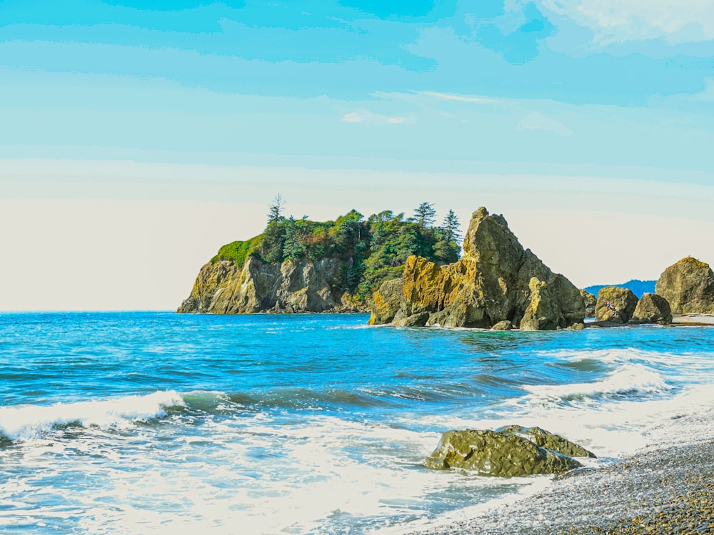 brown and green rock formation on sea under blue sky during daytime