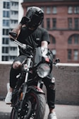 man in black helmet riding motorcycle