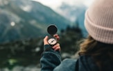 Woman holding compass representing a search for a way back from burnout