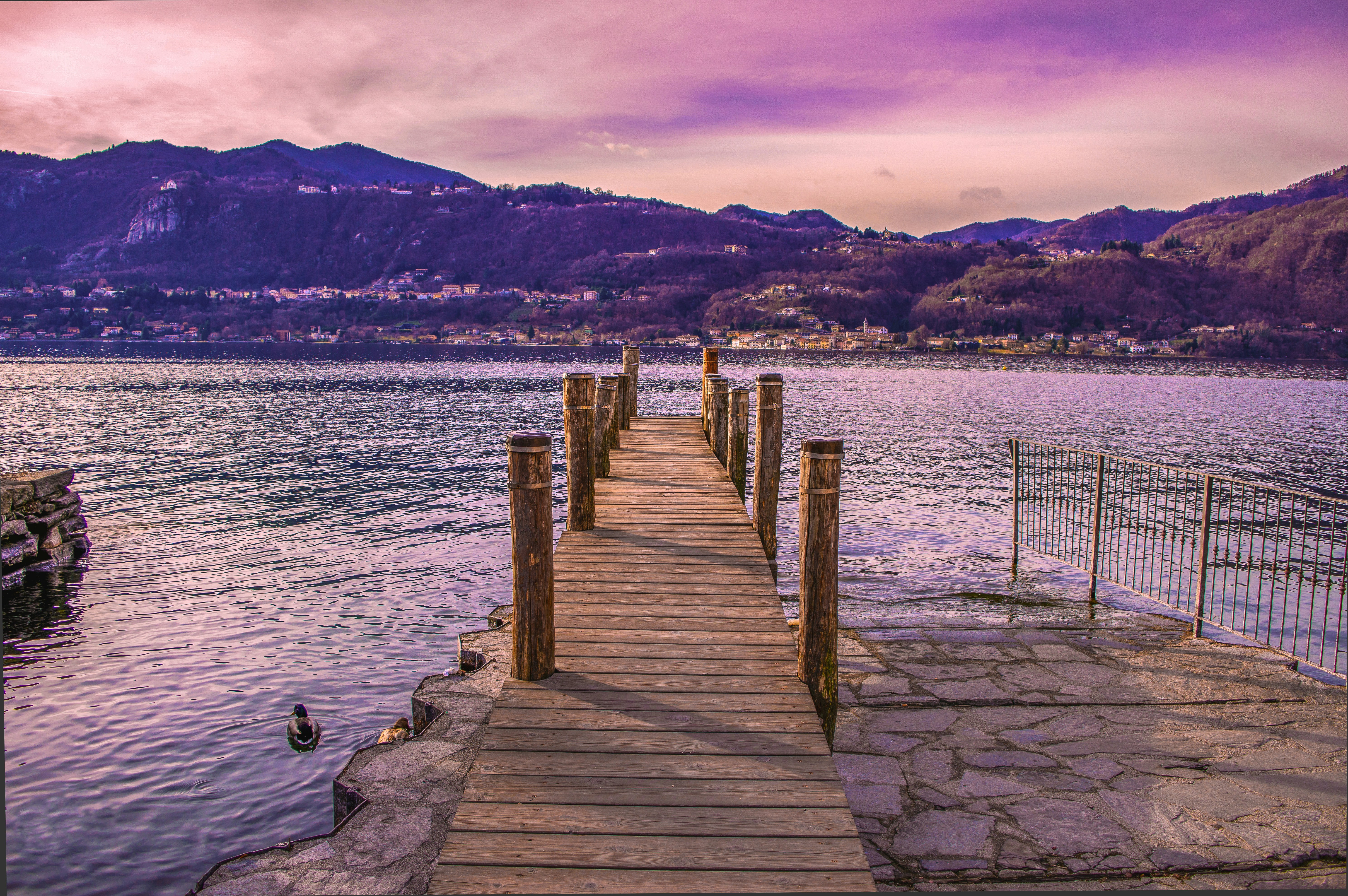 brown wooden dock on body of water during daytime
