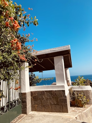 Wide shot of a clean orange patio with crisp white trim after power washing.
