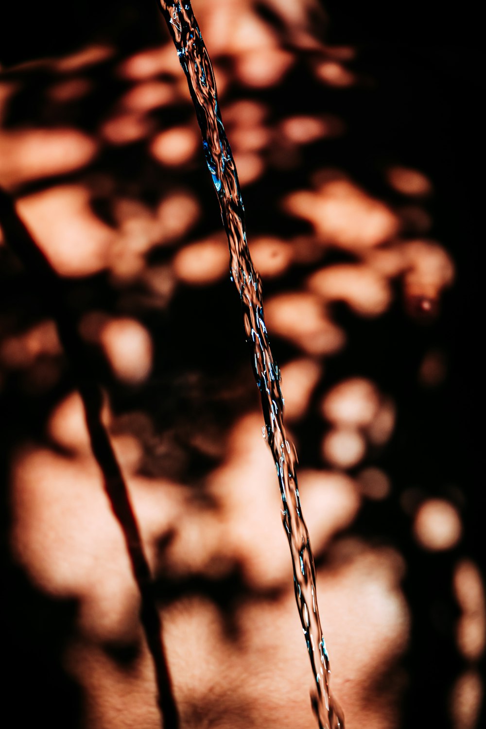 water droplets on brown metal chain