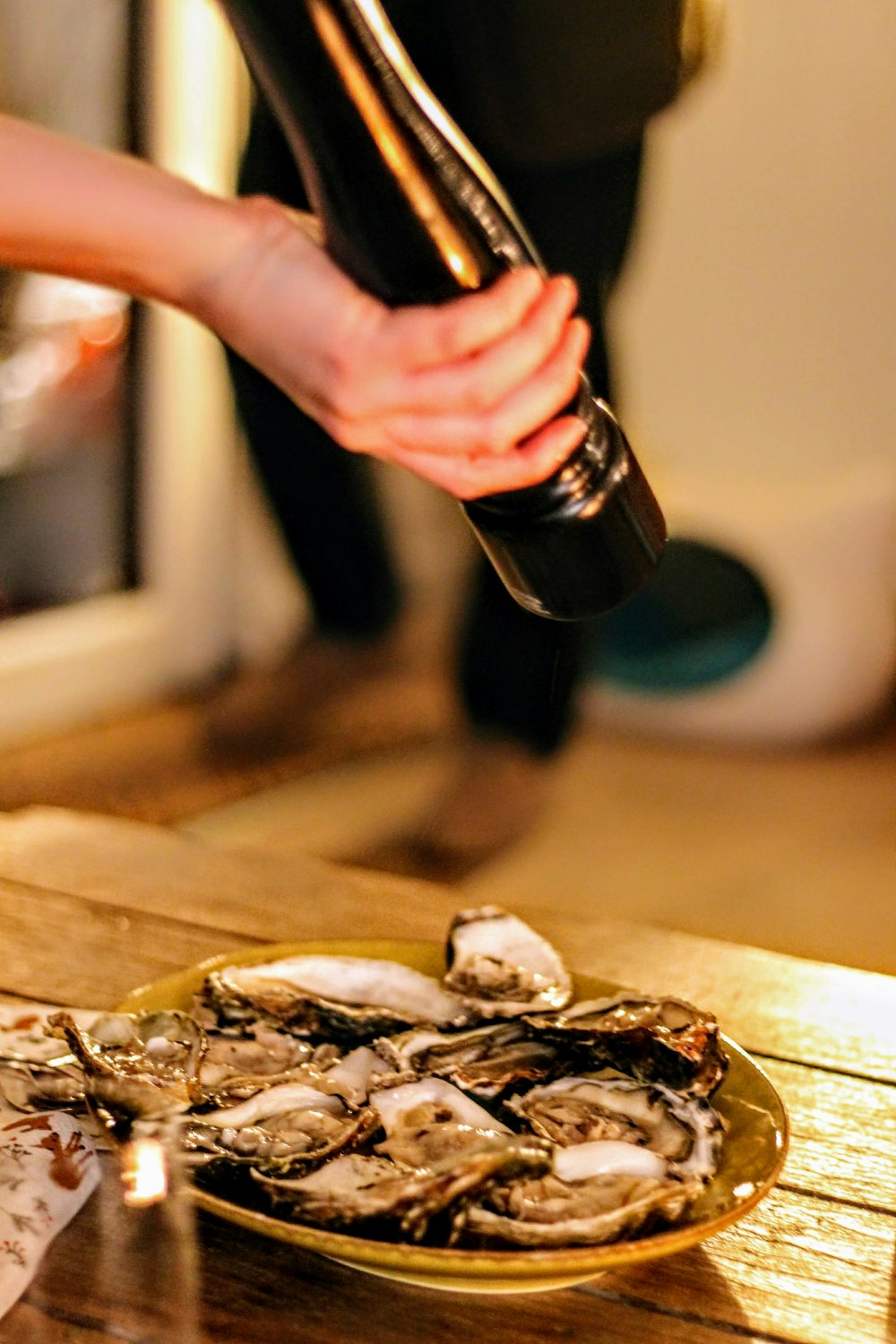 person holding black and silver bottle