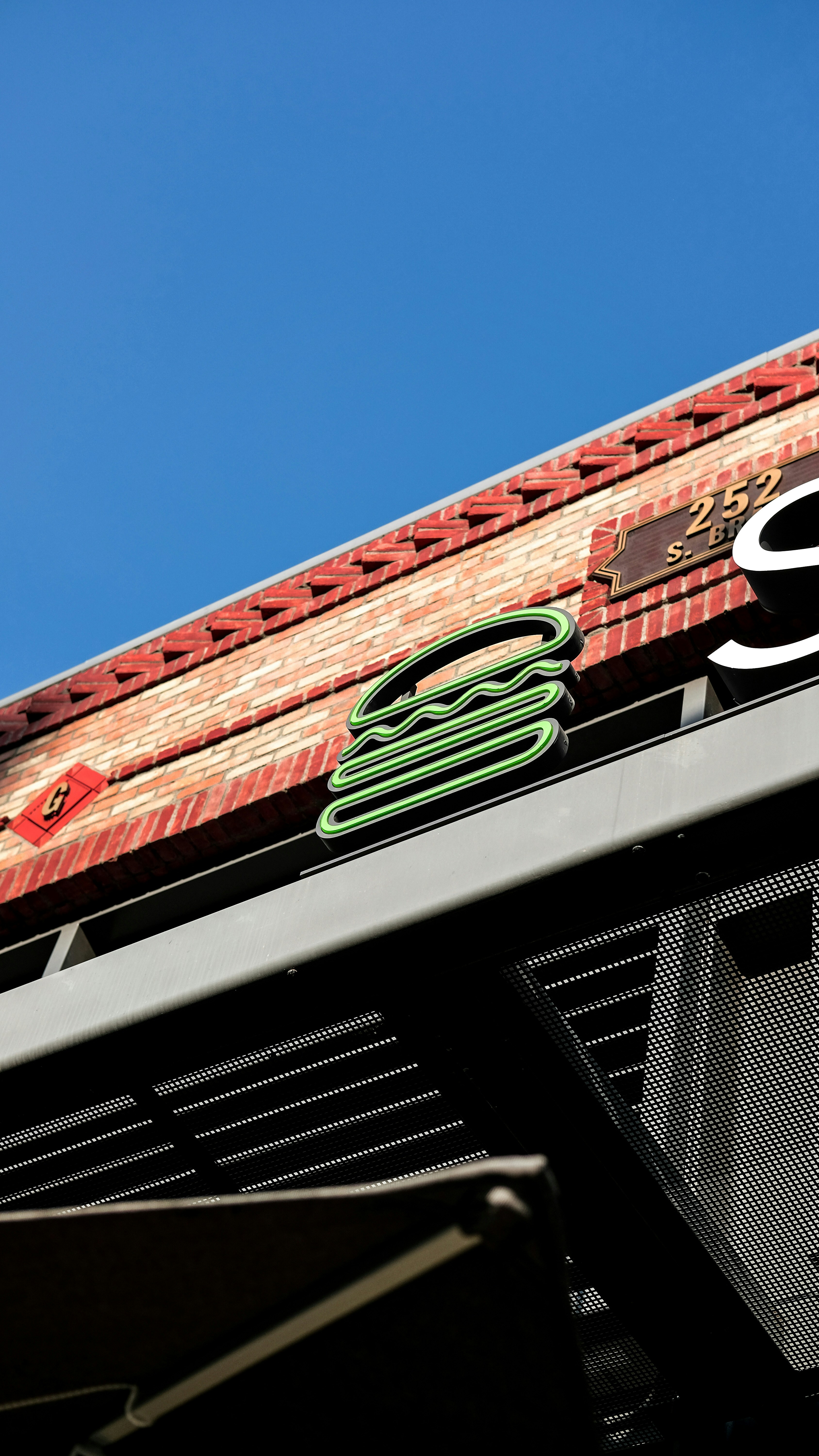 red and white concrete building under blue sky during daytime