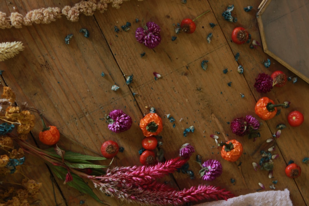 red and green chili peppers on brown wooden table