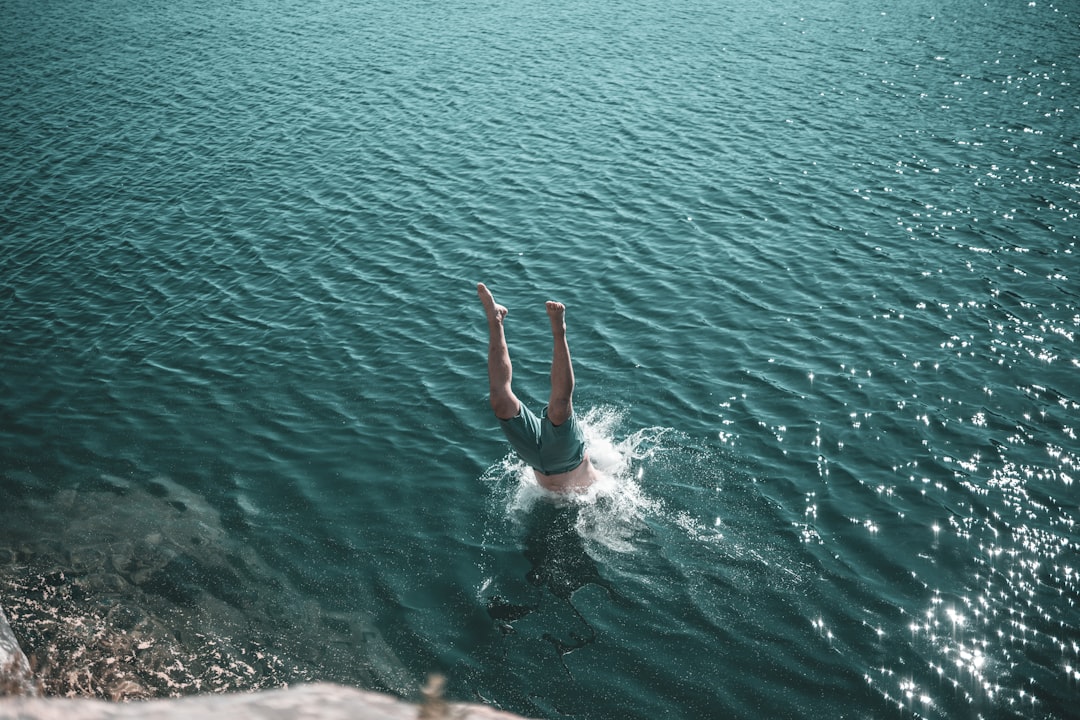 man diving headfirst