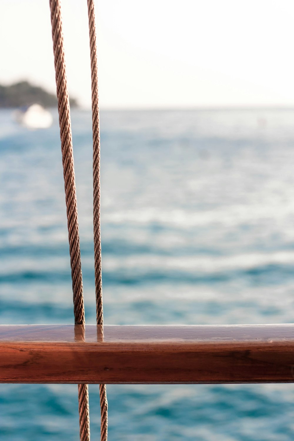 brown rope on brown wooden plank