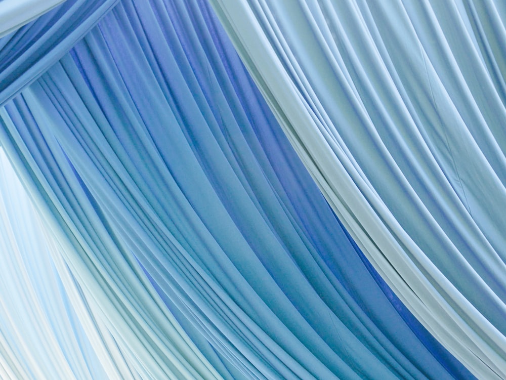 blue and white striped textile