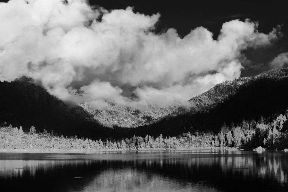 grayscale photo of lake and mountains