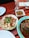 Close-up of a rustic wooden table with traditional Spanish tapas dishes.
