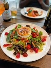 A colorful lunch plating featuring salads and sandwiches.