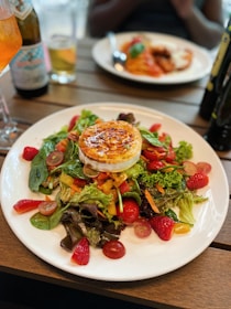 A colorful lunch plating featuring salads and sandwiches.