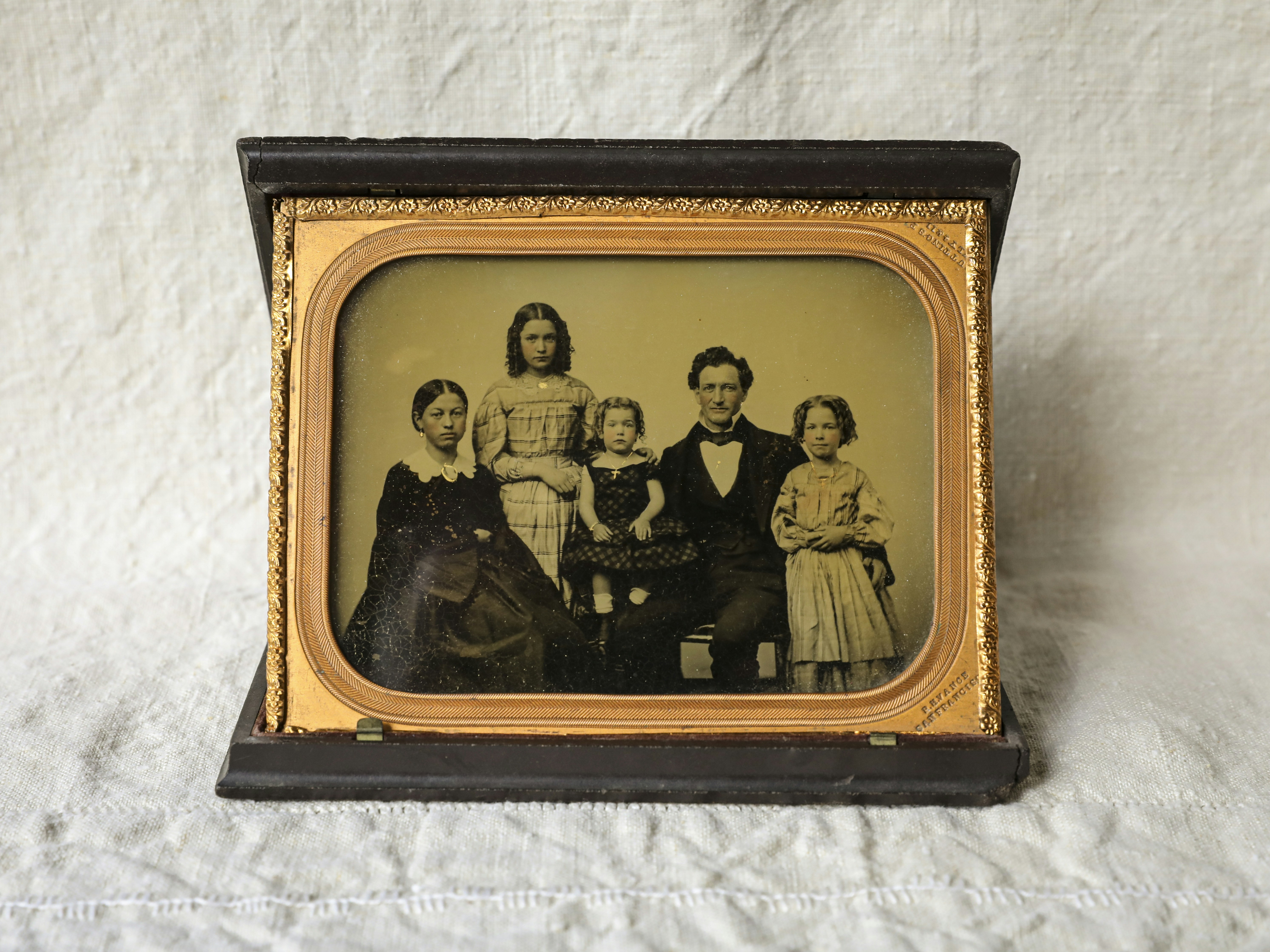 Vintage daguerreotype family portrait from 1852