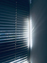 Motorized curtains smoothly closing as the evening light filters through the window.